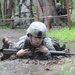 OSW soldier low crawls through mud