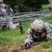 OSW soldier low crawls under barbed wire