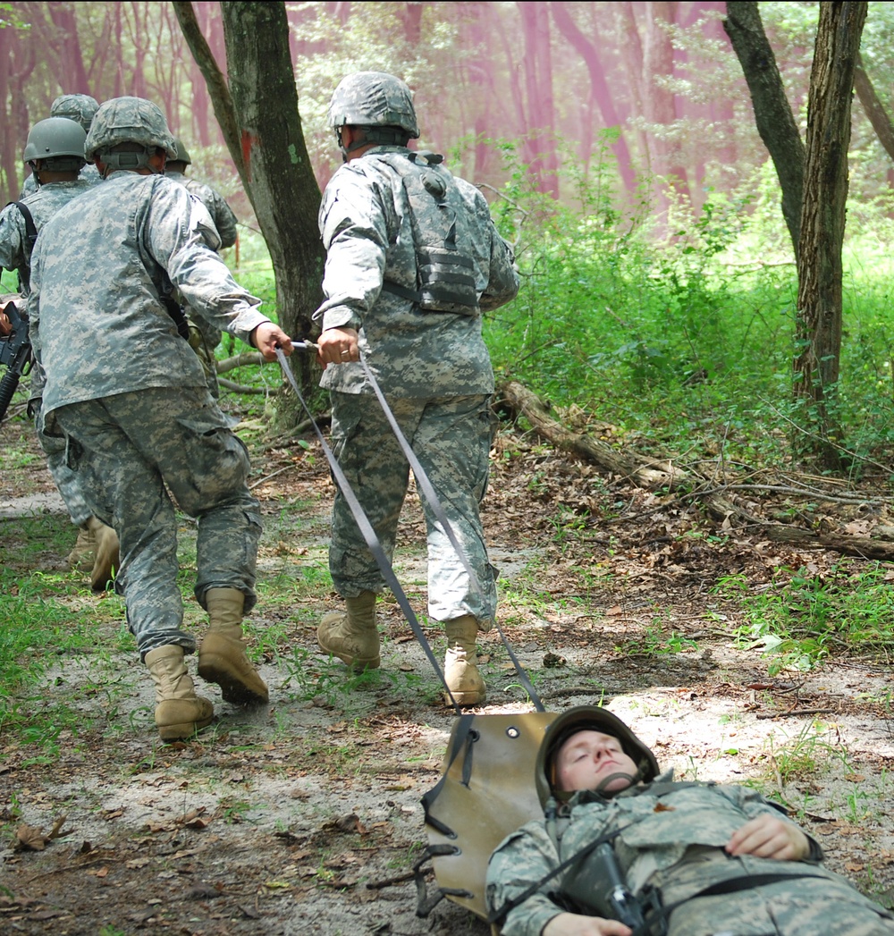 OSW soldiers drag a litter