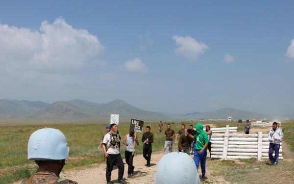 MAF Soldiers quell a riot during exercise Khaan Quest 2013