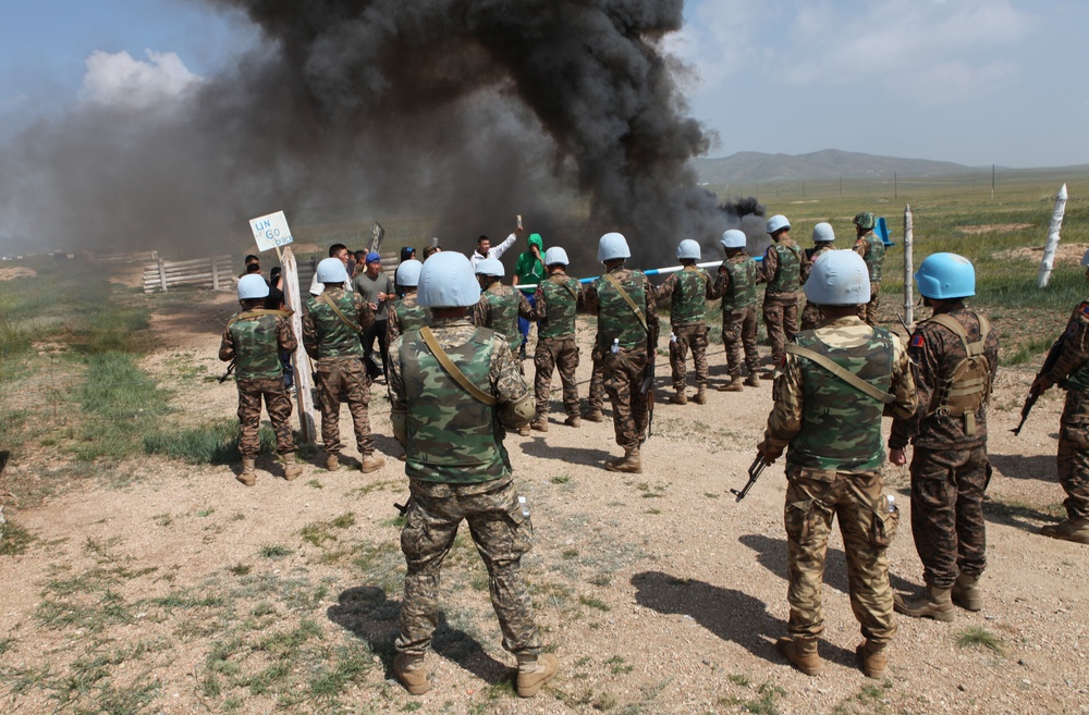 MAF Soldiers quell a riot during exercise Khaan Quest 2013