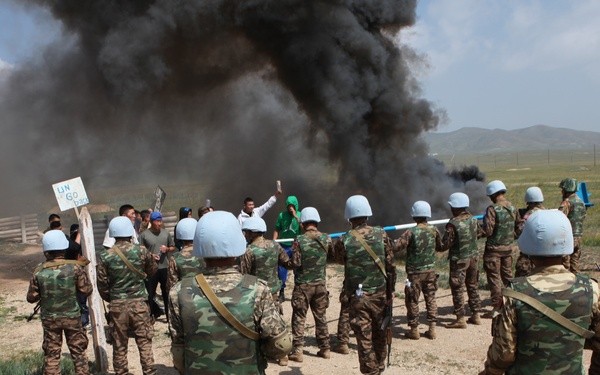 MAF Soldiers quell a riot during exercise Khaan Quest 2013