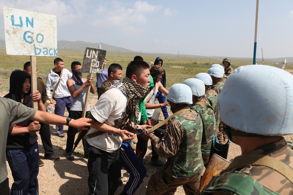 MAF Soldiers quell a riot during exercise Khaan Quest 2013