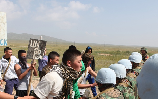 MAF Soldiers quell a riot during exercise Khaan Quest 2013