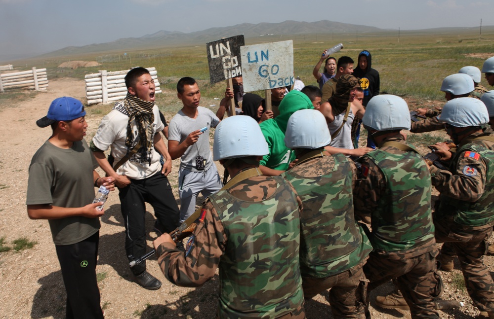 MAF Soldiers quell a riot during exercise Khaan Quest 2013