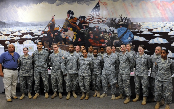 OSW NYC Commissioner Holliday poses with New York soldiers