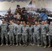 OSW NYC Commissioner Holliday poses with New York soldiers