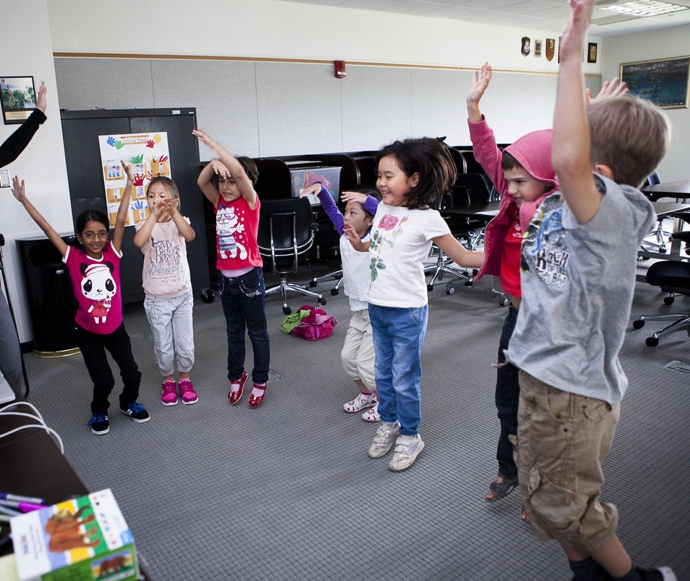 Family members of international fellows at NDU go to school