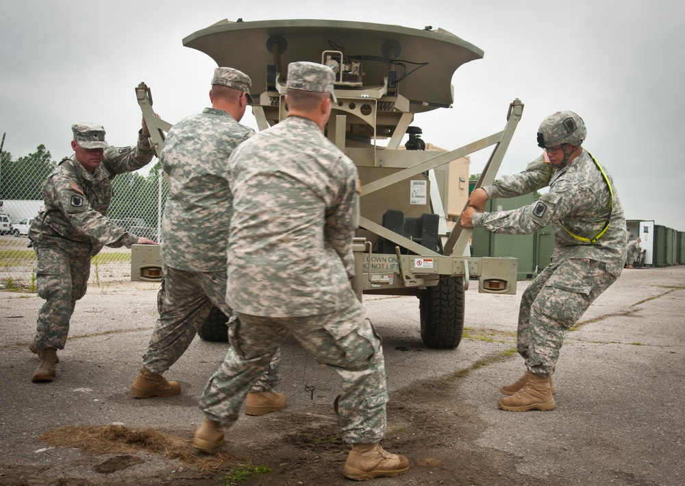35th ESB soldiers set up satellite terminal trailer for Vibrant Response 13-2
