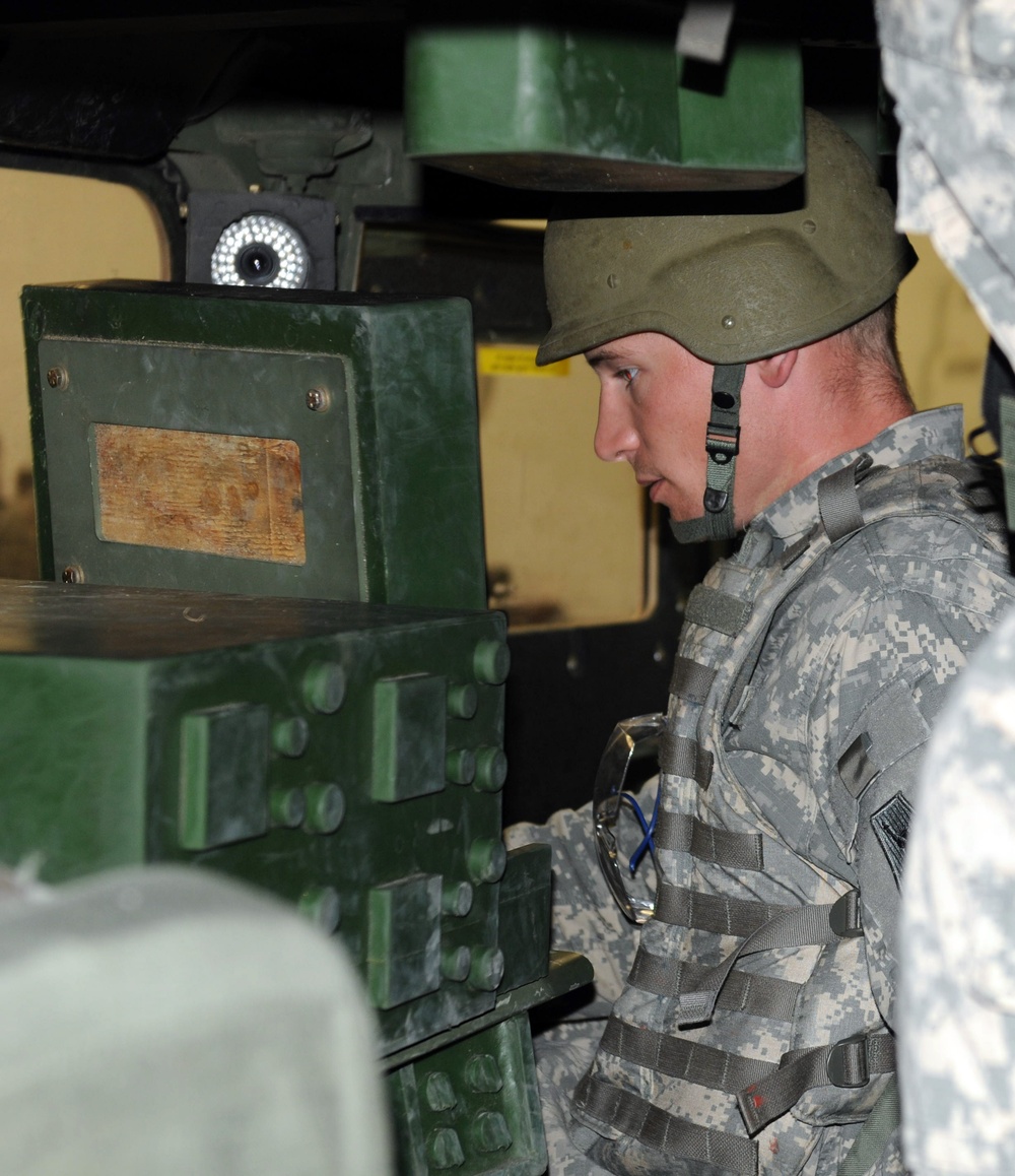 OSW soldier in HMMWV Egress Assistance Trainer