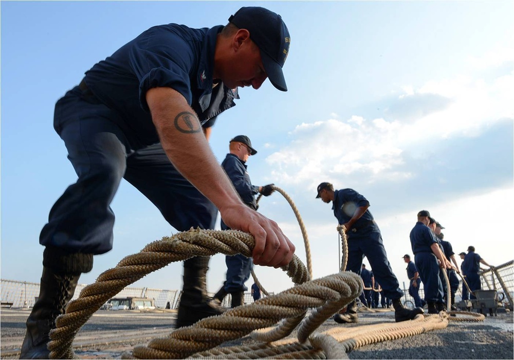 Sailor lays line during sea-and-anchor