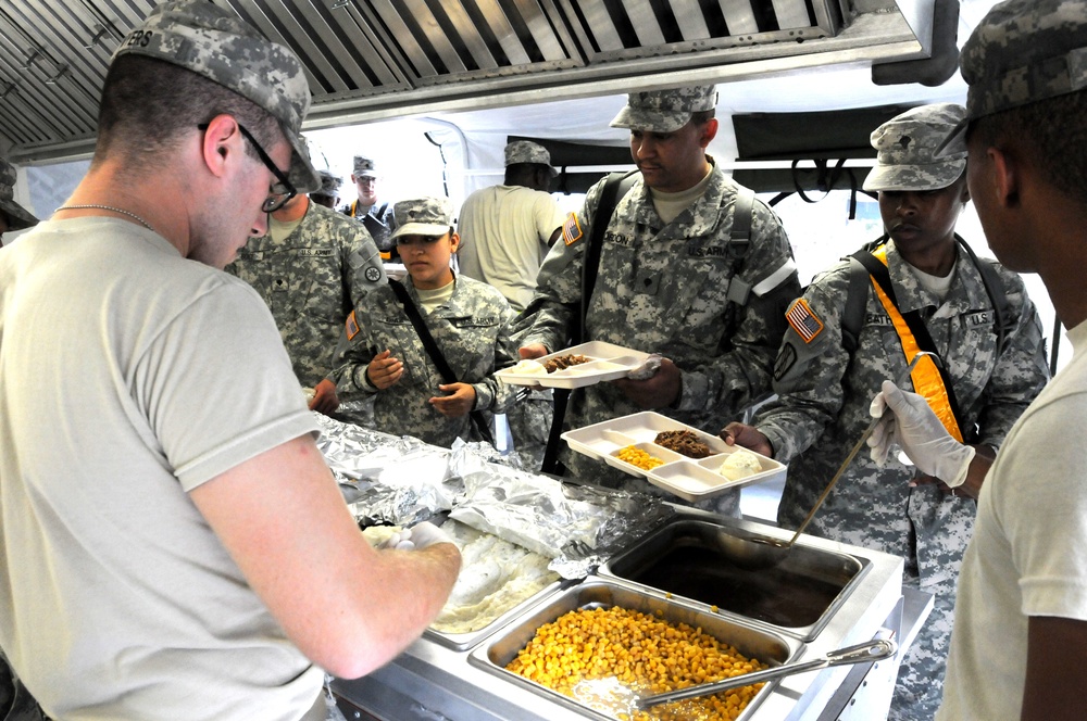 Food service specialists serve chow
