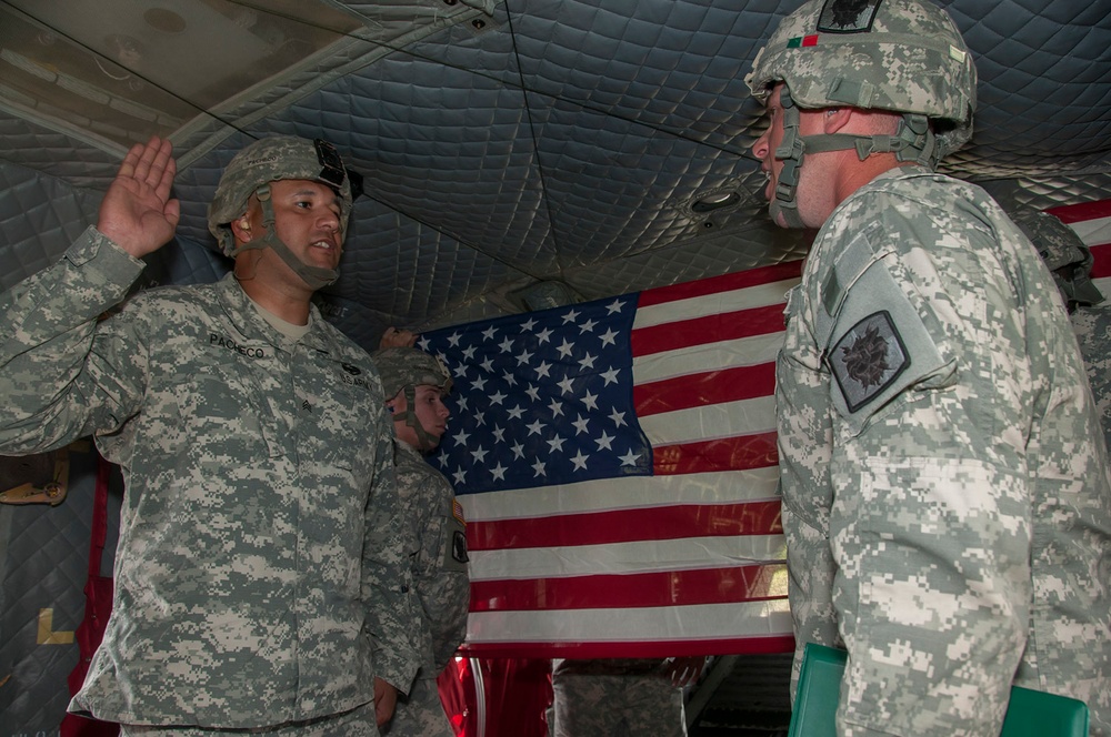 Re-enlistment by air: two soldiers re-enlist in the sky above Camp Atterbury