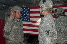 Re-enlistment by air: two soldiers re-enlist in the sky above Camp Atterbury