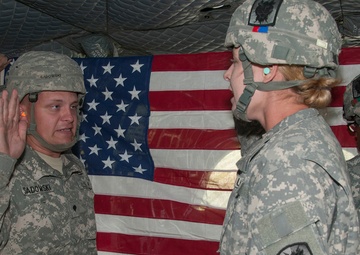 Re-enlistment by air: two soldiers re-enlist in the sky above Camp Atterbury