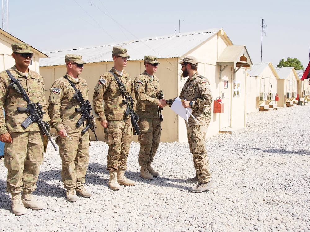 1st Lt. Sandro awards gold Schützenschnurs to Apache Troop soldiers on FOB Kunduz