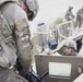 Pfc. Chapman reassembles a M2 .50cal machine gun during a competition as his teammate watches