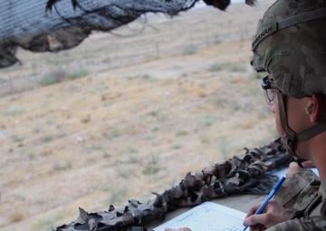 Pfc. Markham completes a range card as part of an individual skill competition