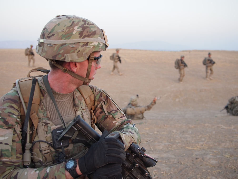 2nd Lt. Jenson checks his grid location while his platoon reconsolidates during a dismounted patrol outside of FOB Kunduz