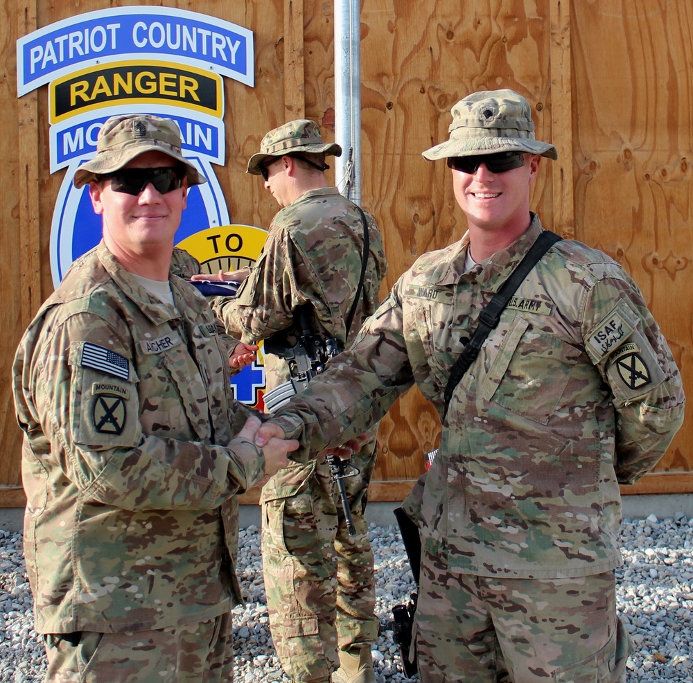 Spc. Christopher Ward re-enlists
