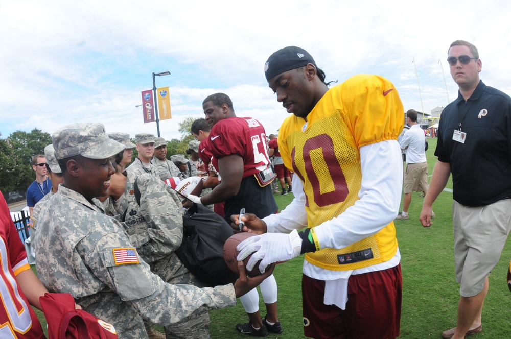 RGIII signs football