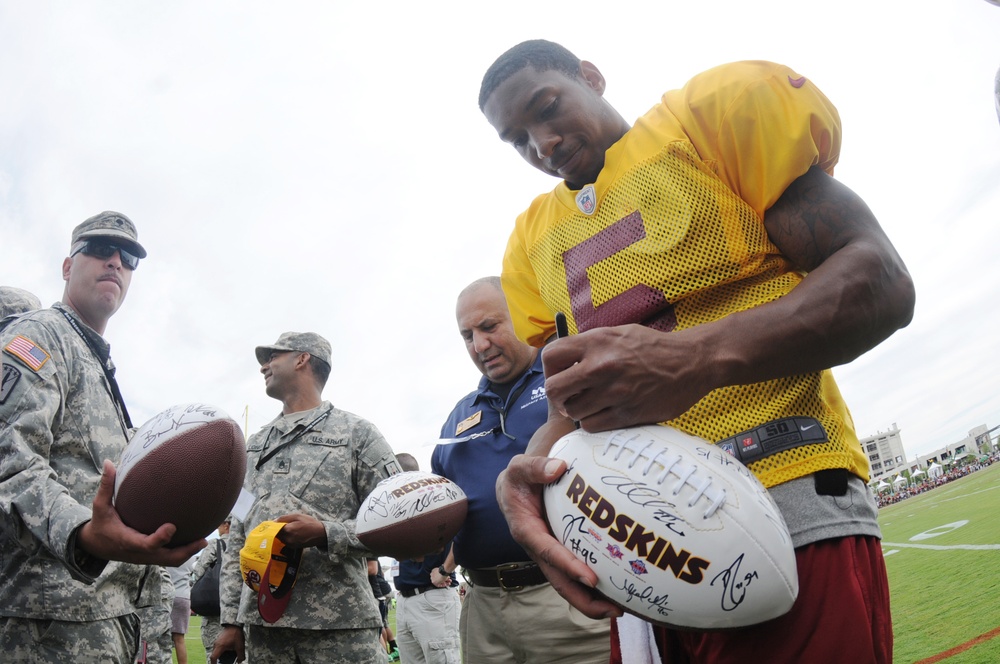 Redskins' Pat White signs autograph for soldier