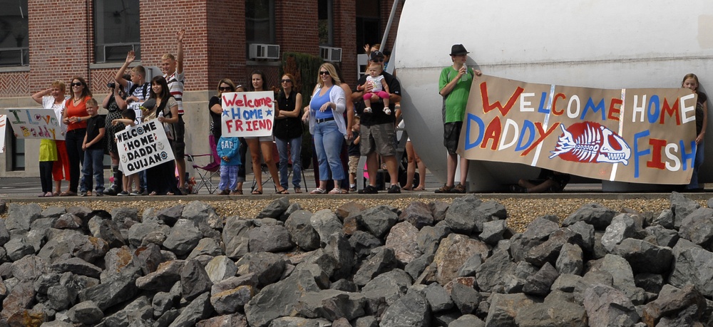 Family and friends welcome home members from Coast Guard Cutter Stratton