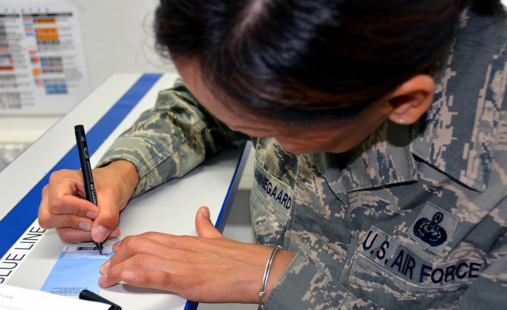 Component issues 20,000th identification card to Sergeant GK