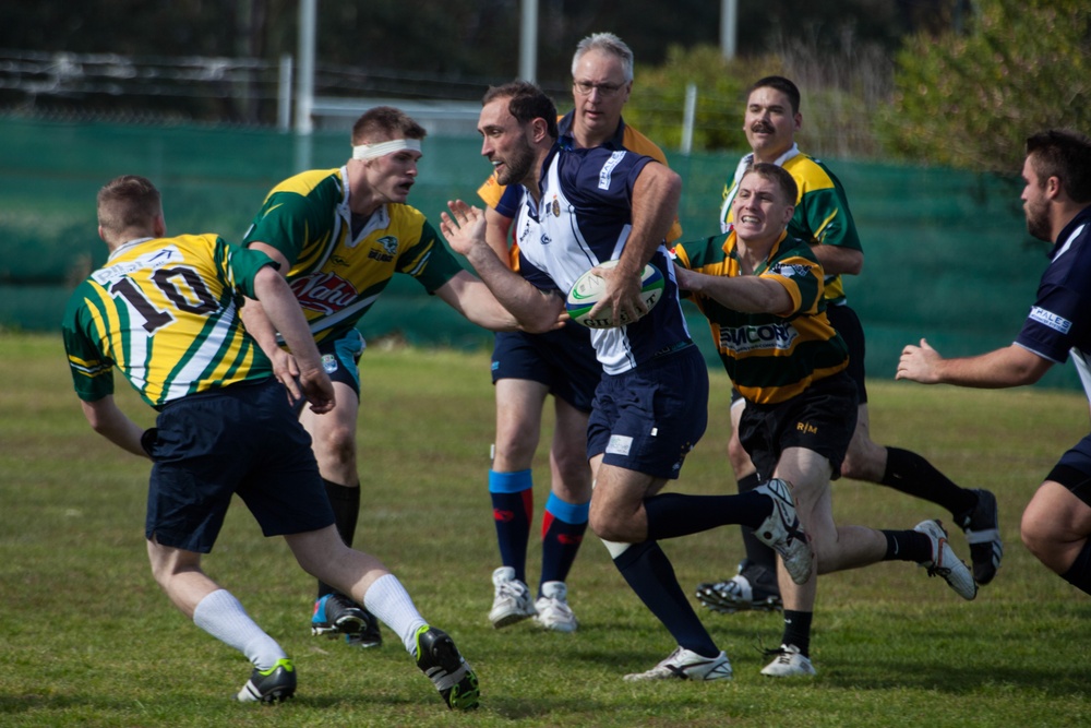 A couple of ‘friendlies’ amongst friends: U.S. Marines and Sailors square off against Australian Navy teams in rugby, soccer