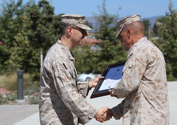 1st MLG Marine pins on lieutenant colonel