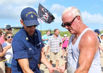 Coast Guard members support release of 7 endangered turtles at Texas beach