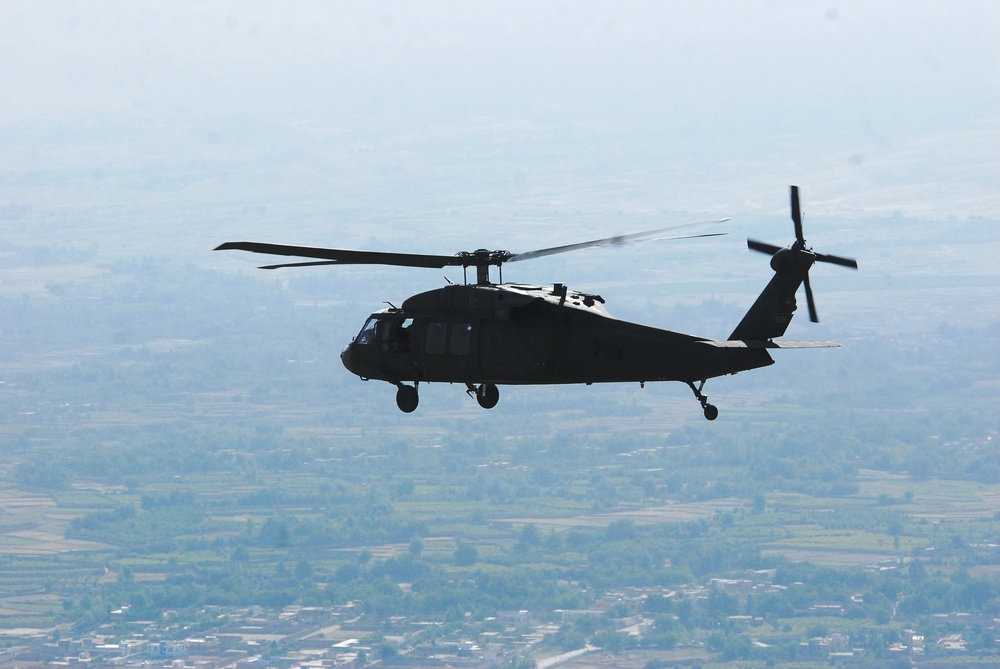 Task Force Falcon UH-60 Black Hawk helicopters transport personnel in eastern Afghanistan