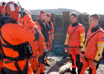 Coast Guard members conduct survival swim training