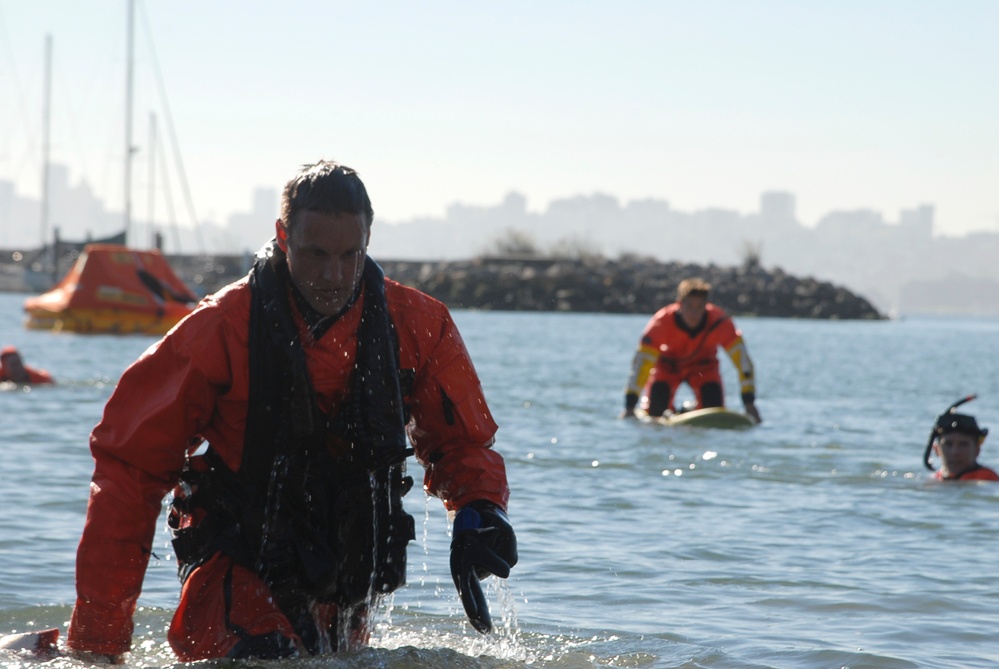 Coast Guard members conduct survival swim training