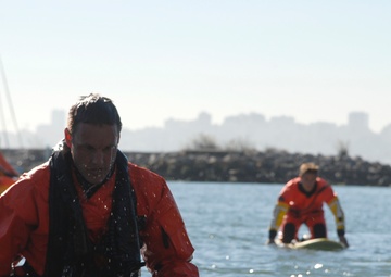 Coast Guard members conduct survival swim training