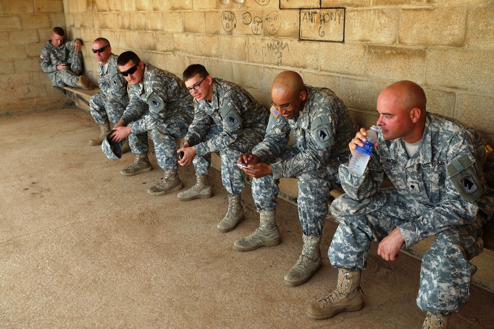 Kentucky soldiers relax between duties on a hot August day