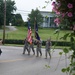 Four soldiers march in a parade honoring military Veterans