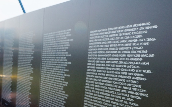 A vase of flowers pays tribute to those lost in the Vietnam War