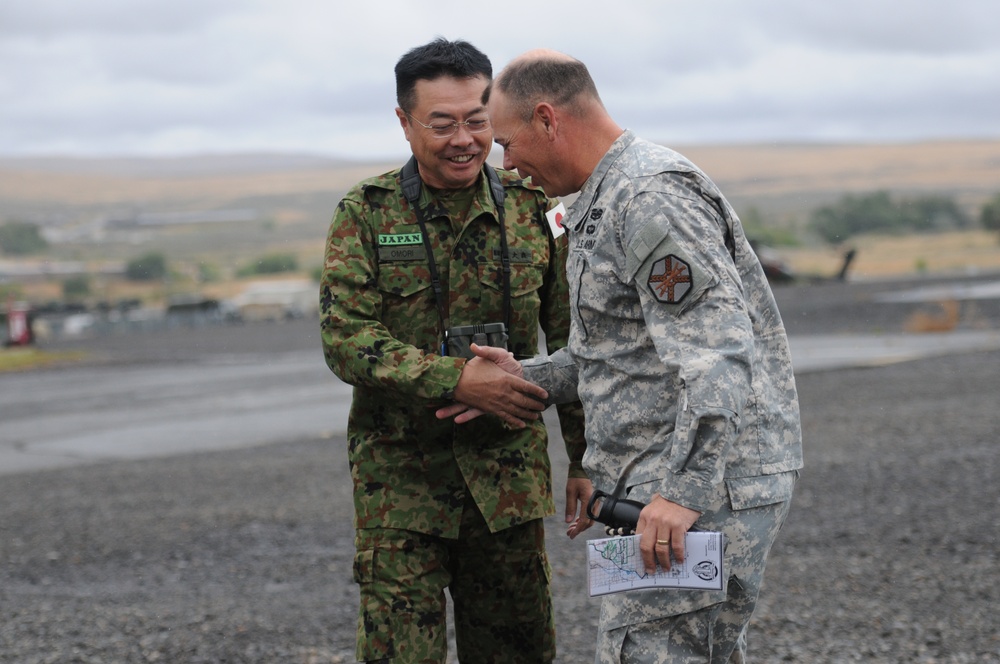 A Japanese major general gets an aerial tour of the Yakima Training Center