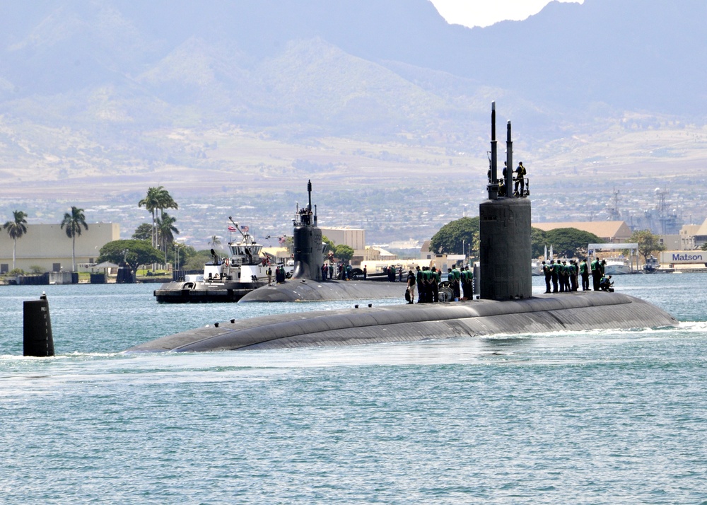 USS Tucson departs