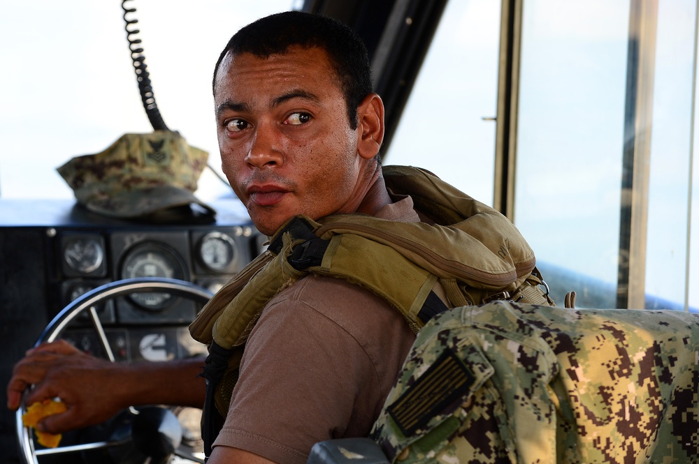 Commander, Task Group (CTG) 56.7 security boat escort