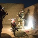 Coalition force members conduct operation in Helmand province