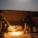 Coalition force members conduct operation in Helmand province