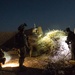 Coalition force members conduct operation in Helmand province