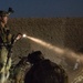 Coalition force members conduct operation in Helmand province