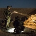 Coalition force members conduct operation in Helmand province