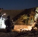 Coalition force members conduct operation in Helmand province