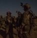 Coalition force members conduct operation in Helmand province