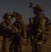 Coalition force members conduct operation in Helmand province