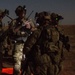 Coalition force members conduct operation in Helmand province